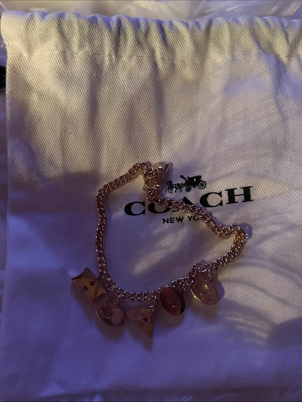 Coach Gold-Tone Charm Bracelet with Crystal Accents